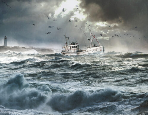 Giant waves break near the lighthouse at peggy's cove, nova scotia.